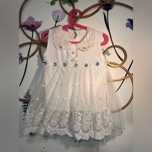 White Lace Baby Dress: Floral Embroidery, glitzy jewel buttons and lace details